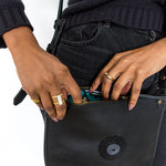 Thick Open Brass Ring on Model with Black Beaded Purse