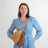 faux suede skyler sling bag