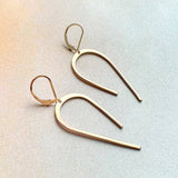 arco arch swooping line earrings