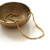 golden unity seed bead necklace