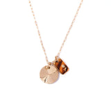 glass and sunburst charm necklace