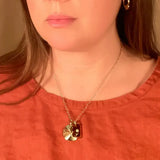 glass and sunburst charm necklace