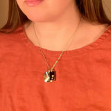 glass and sunburst charm necklace